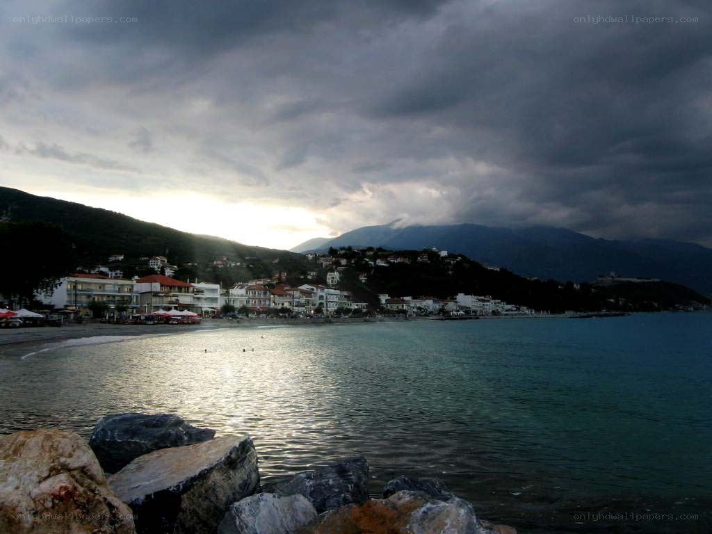 coastal town under stormy sky