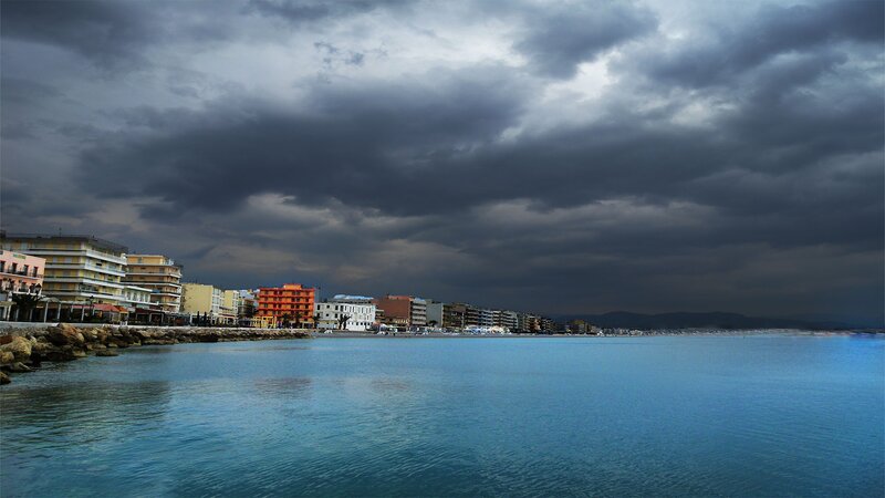 coastal town under stormy sky
