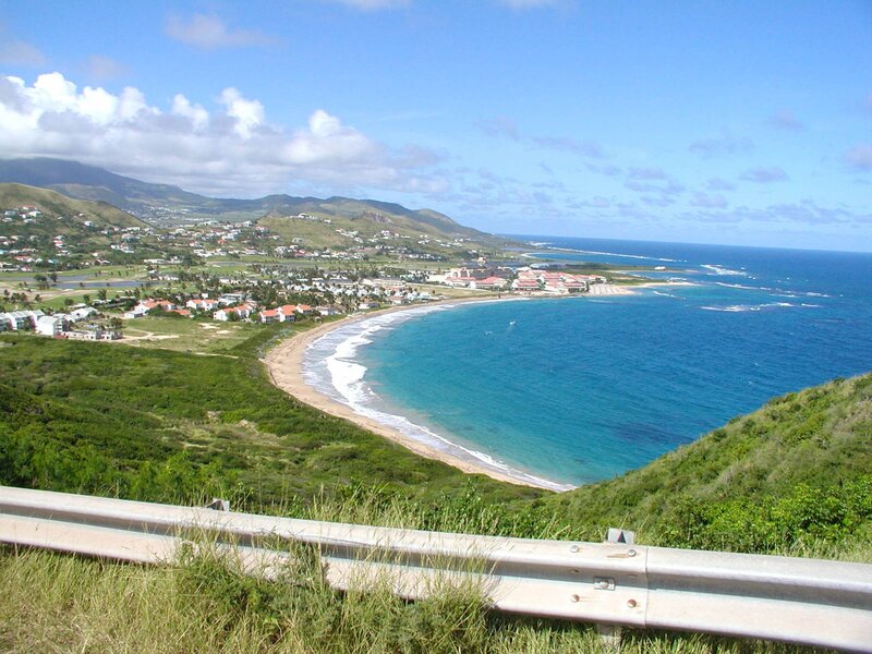 coastal town with bay and mountains