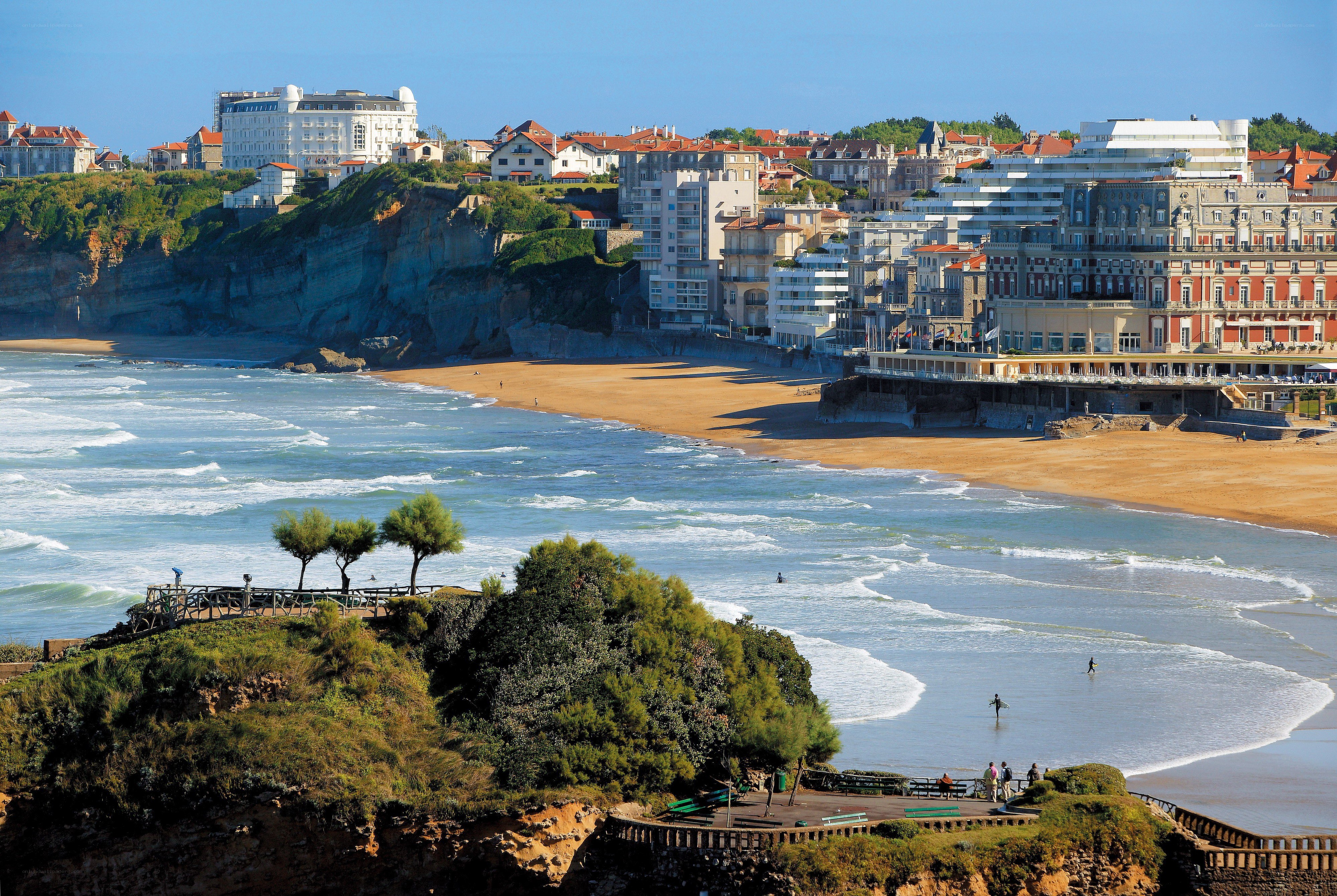 coastal town with beach and cliffs