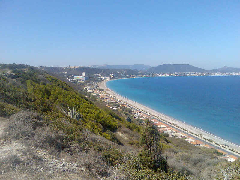 coastal town with beach and hills