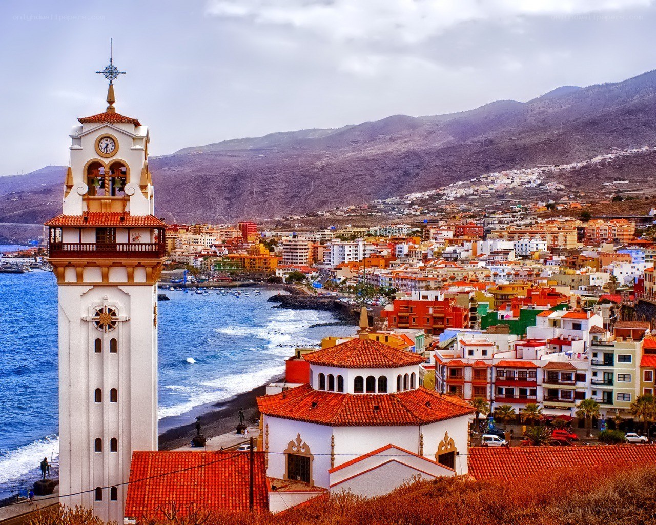 Coastal town with bell tower