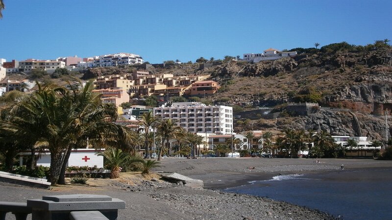 coastal town with black sand beach