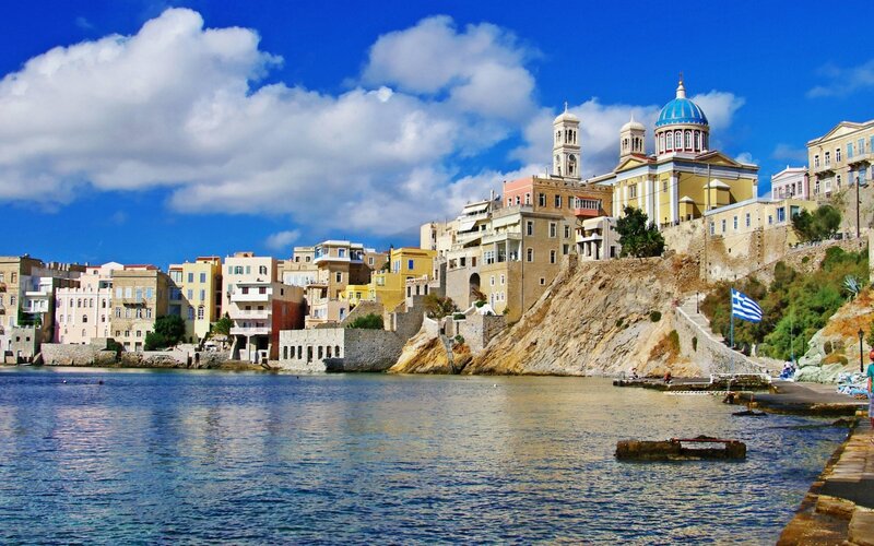 Coastal town with blue-domed church