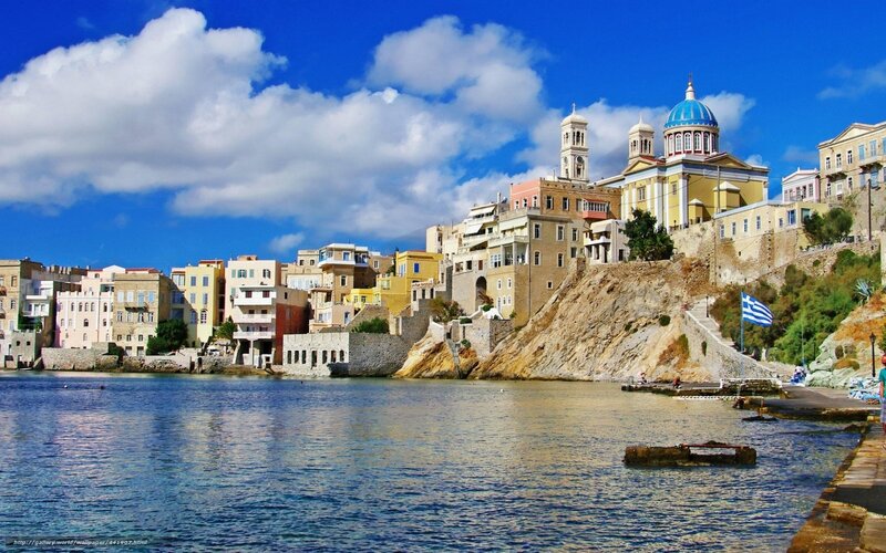 Coastal town with blue-domed church