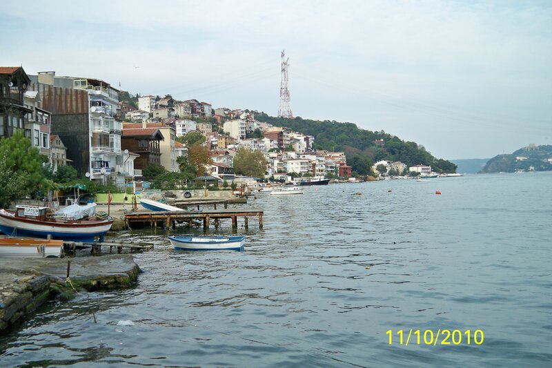 Coastal town with boats and hillside homes