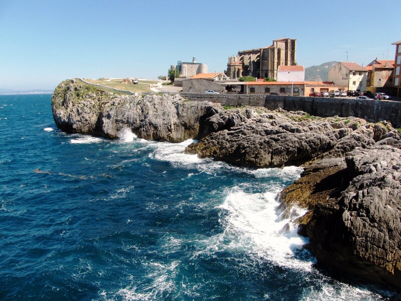 coastal town with church and cliffs