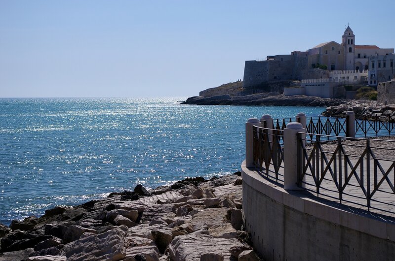 Coastal Town with Church — Blue, Serene, Afternoon, Photograph, Sea, Railing