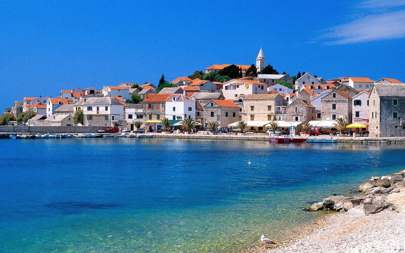 Coastal town with clear blue water