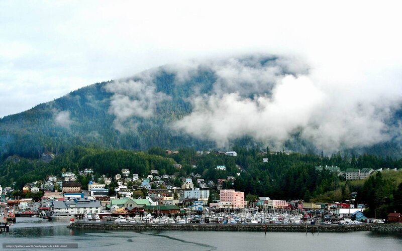 Coastal town with foggy mountain