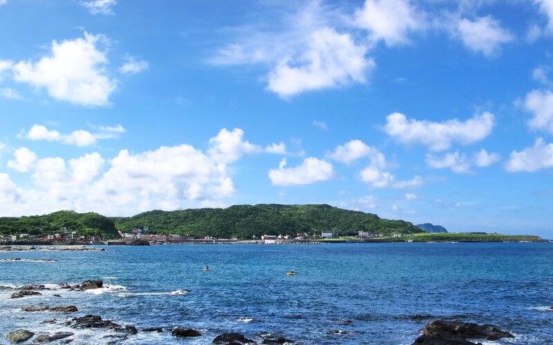 coastal town with green hills