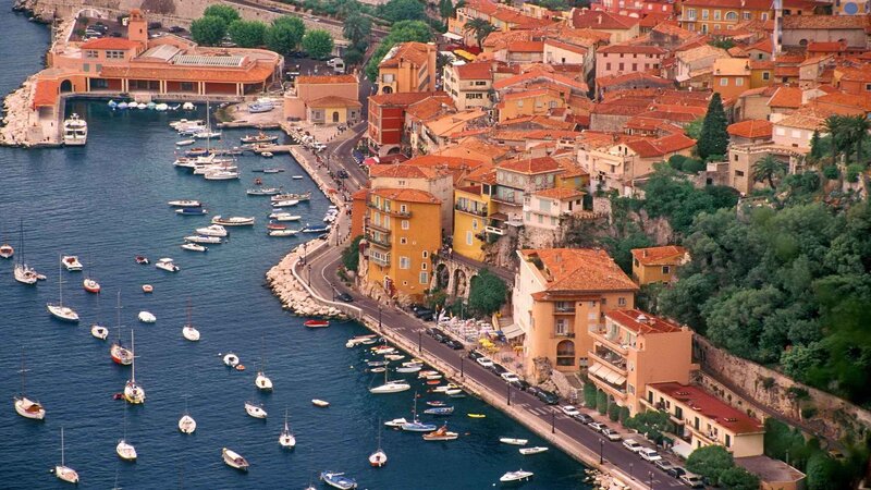 Coastal town with harbor and boats
