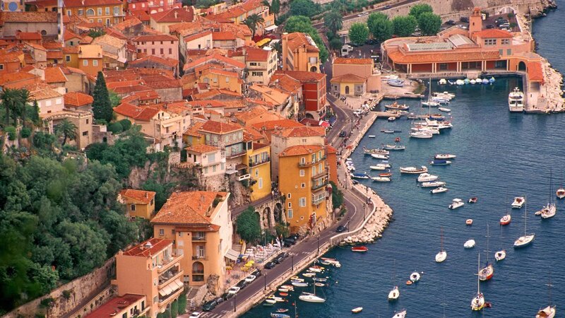 Coastal town with harbor and boats