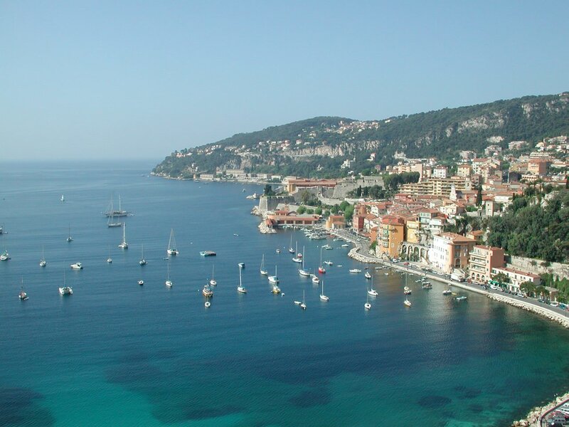 coastal town with harbor and boats