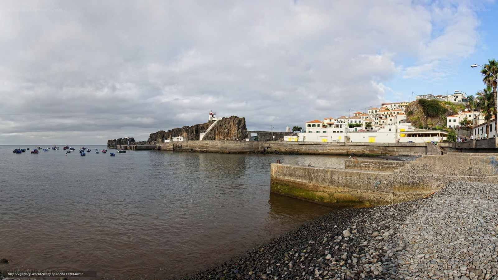 Coastal town with harbor and lighthouse