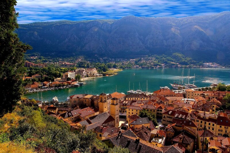 Coastal Town with Harbor — Blue, Serene, Afternoon, Photograph, Mountains, Boats
