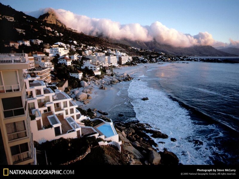 Coastal town with mountain backdrop