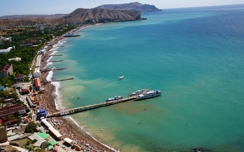 Coastal town with pier and beach