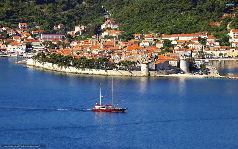 Coastal town with sailboat