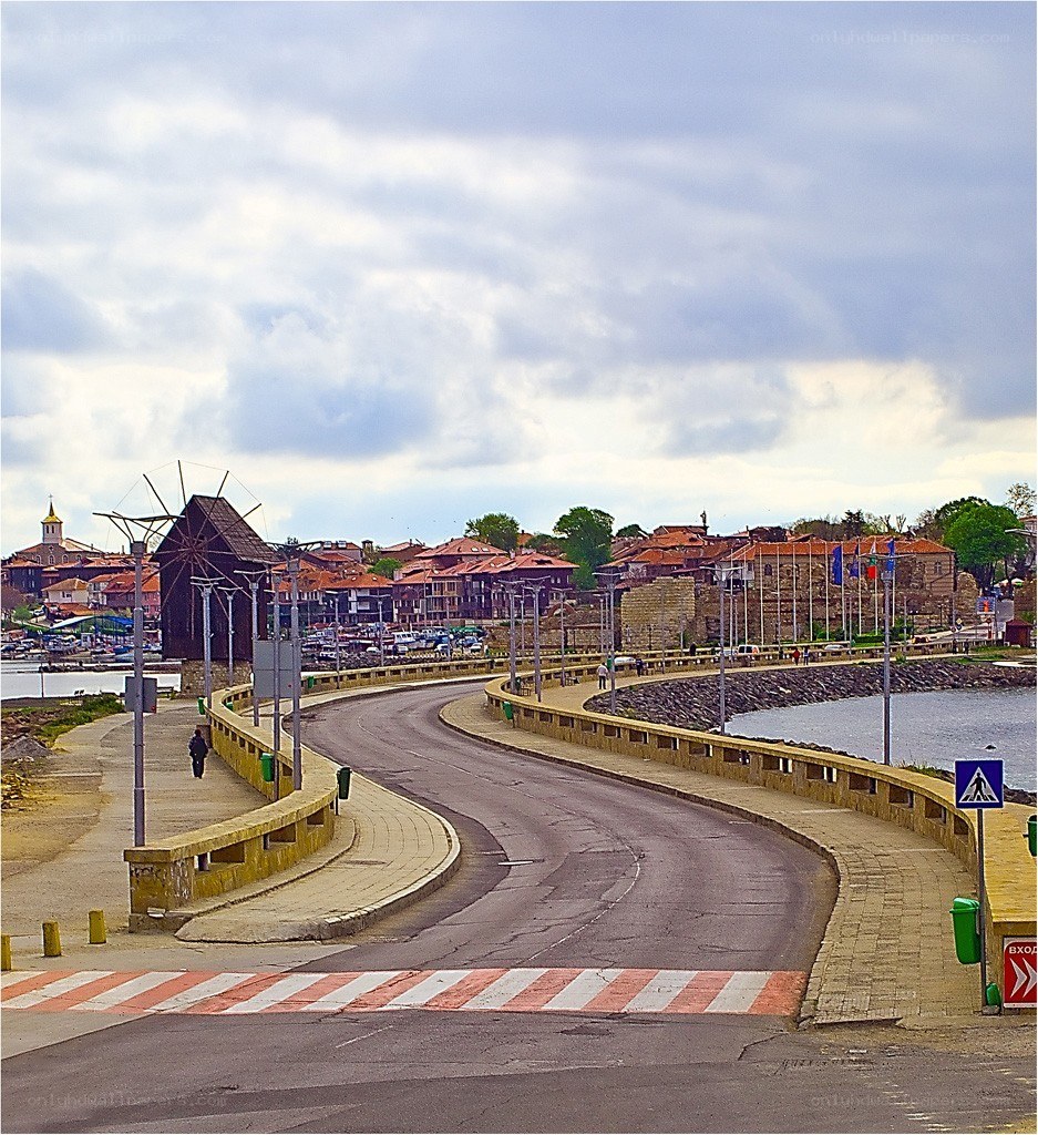 Coastal town with windmill