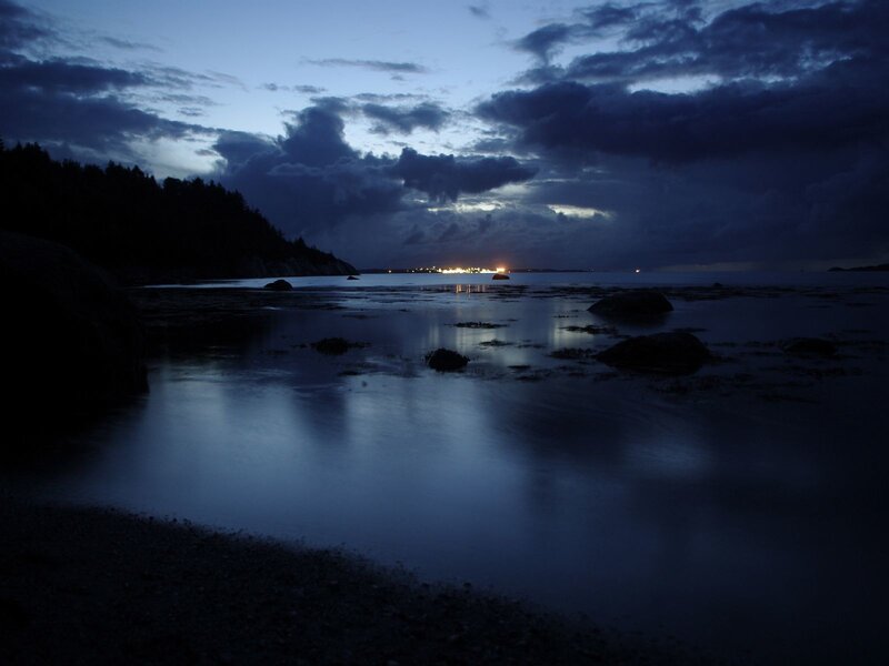 coastal twilight with distant lights