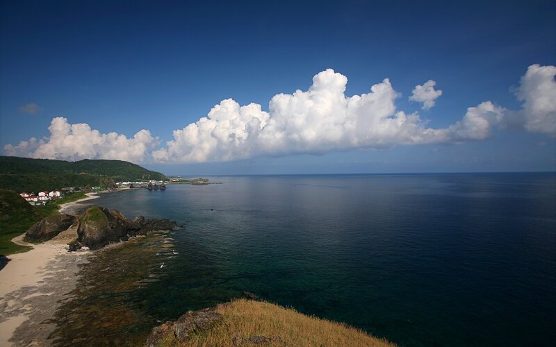 coastal view with white clouds