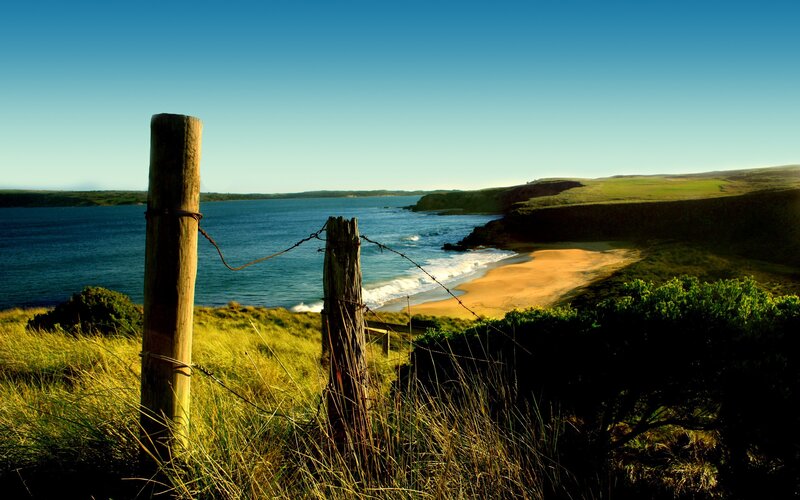 Coastal view with wooden fence