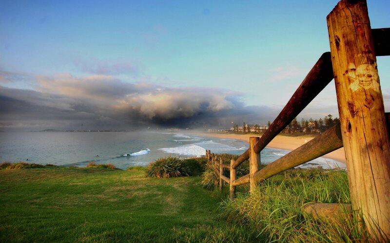 coastal view with wooden fence