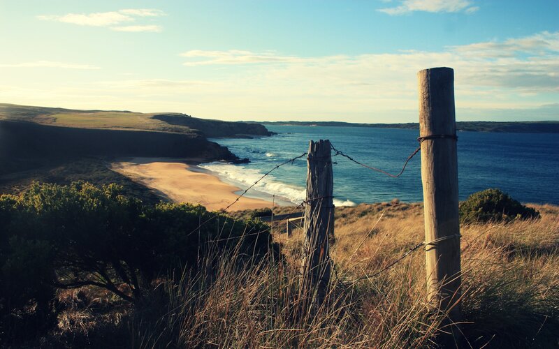 Coastal view with wooden fence