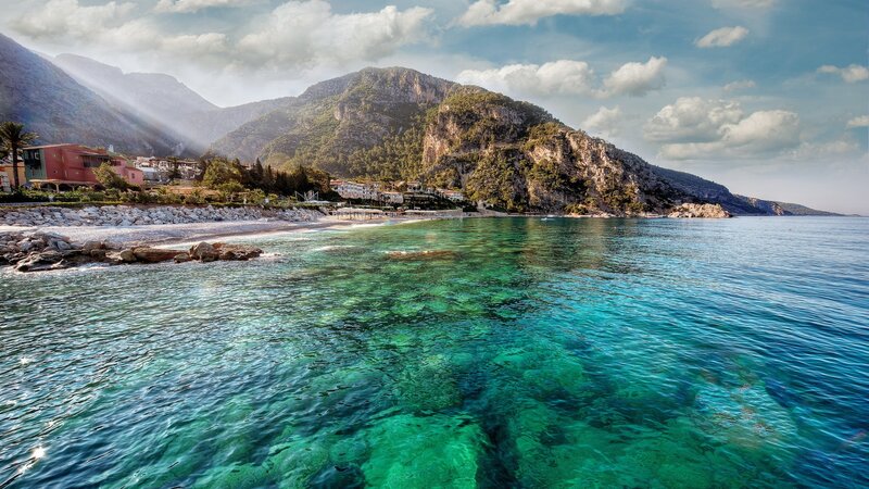 Coastal Village by Mountains — Blue