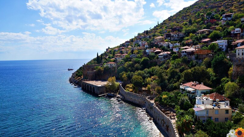 Coastal Village on Hillside — Blue, Serene, Afternoon, Photograph, Sea, Buildings