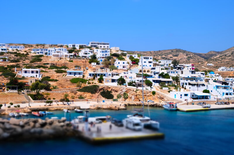 Coastal Village on Hillside — Blue, Serene, Afternoon, Photograph, White Buildings
