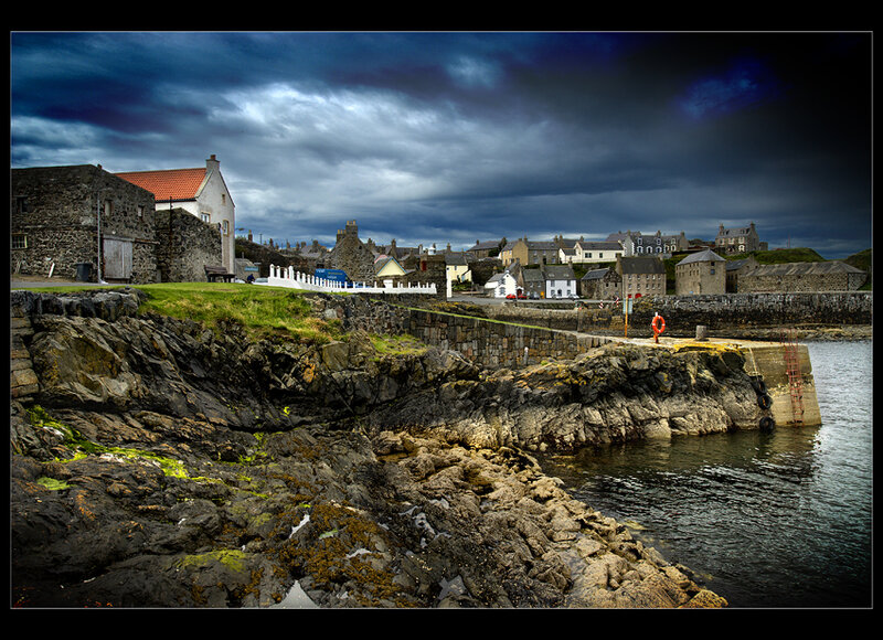 Coastal village under stormy sky