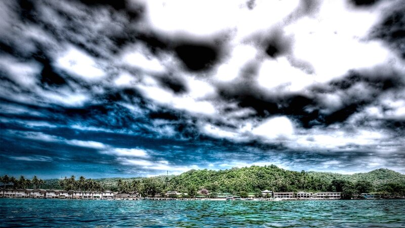 Coastal Village under Stormy Sky — Blue