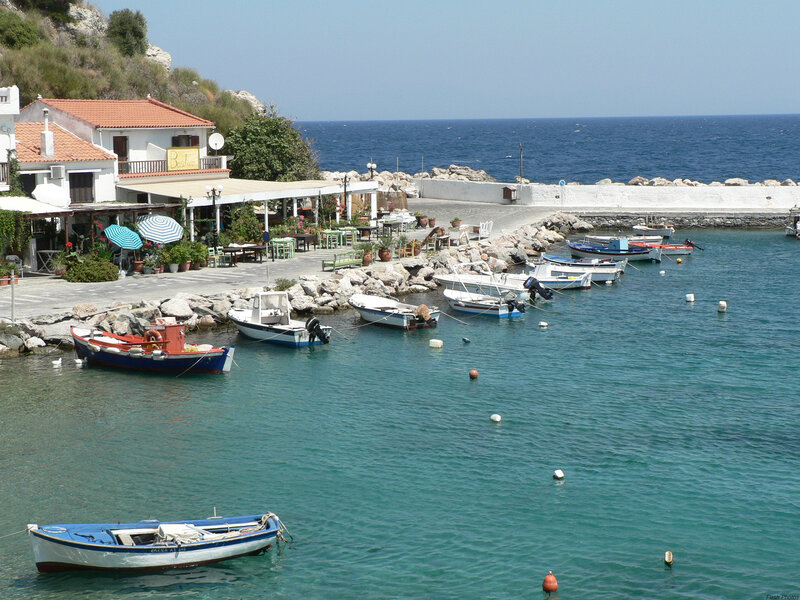 Coastal village with boats and cafe
