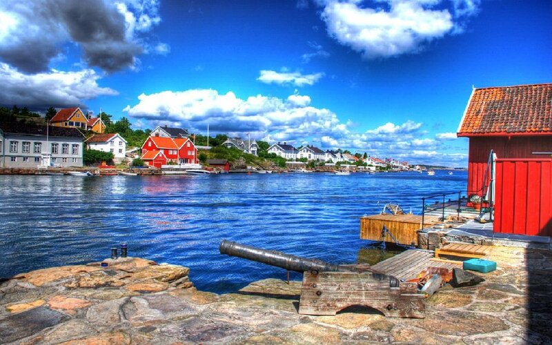 Coastal village with cannon