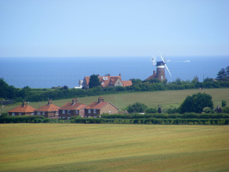 Coastal village with windmill