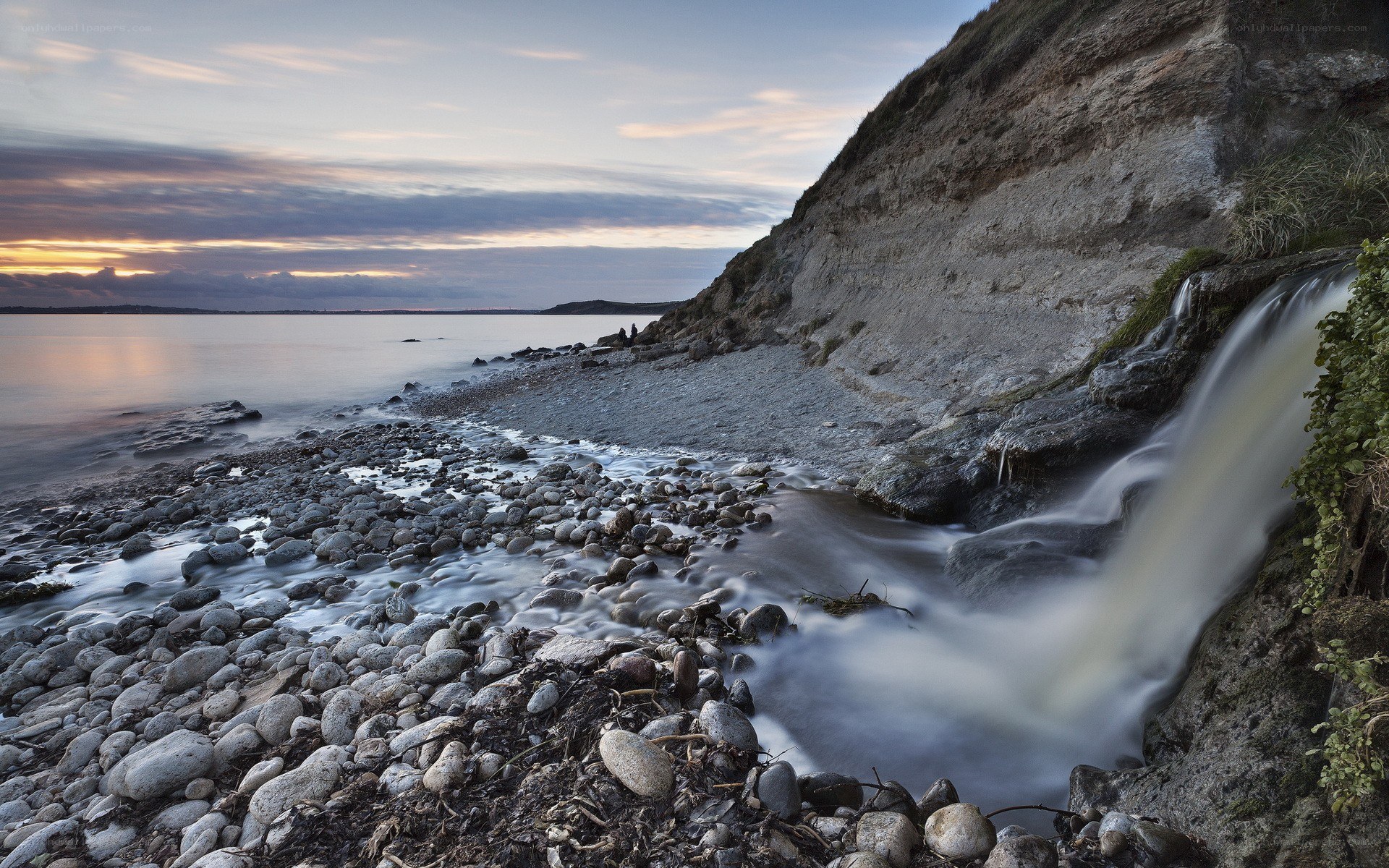coastal waterfall at dusk