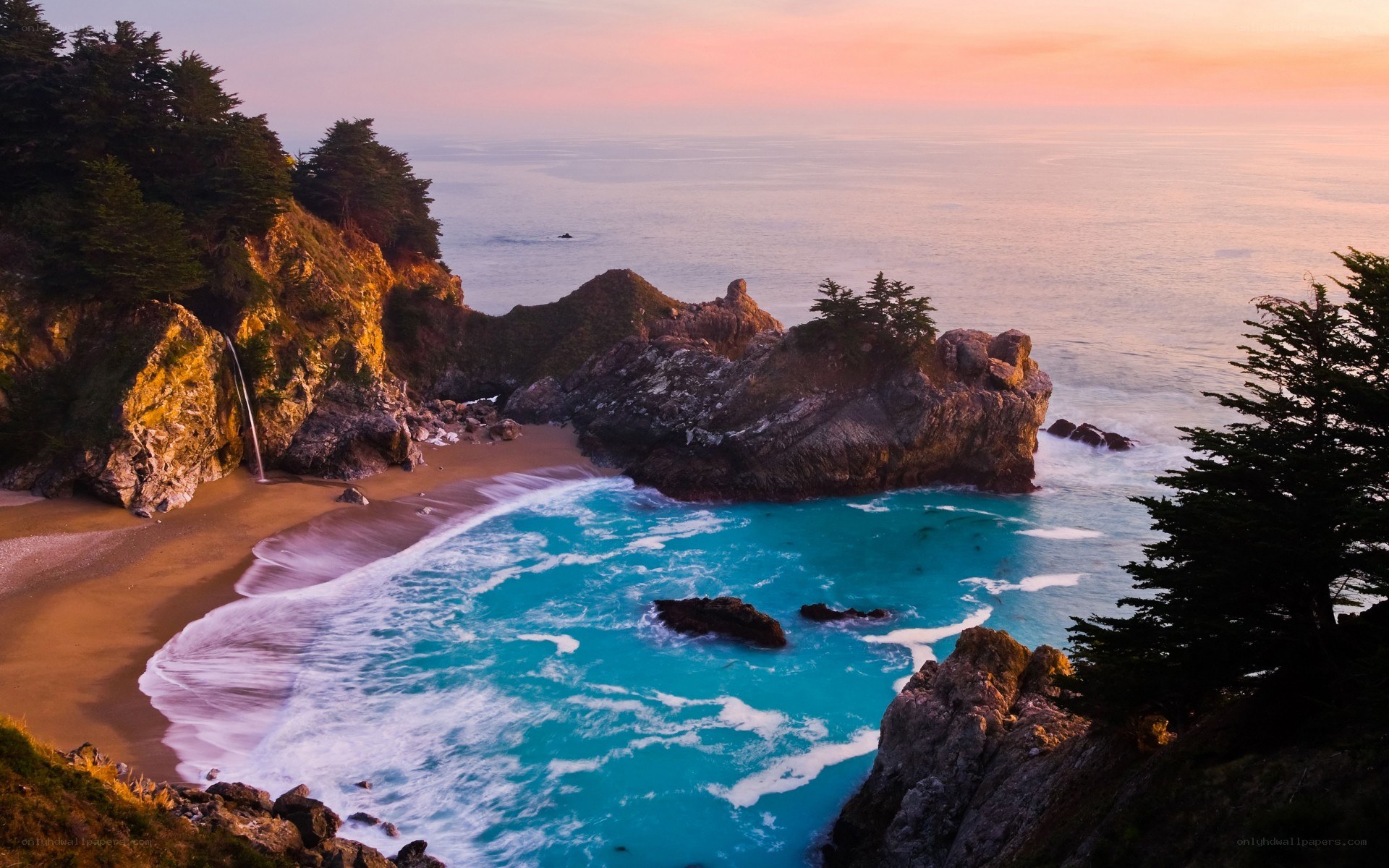 coastal waterfall at sunset