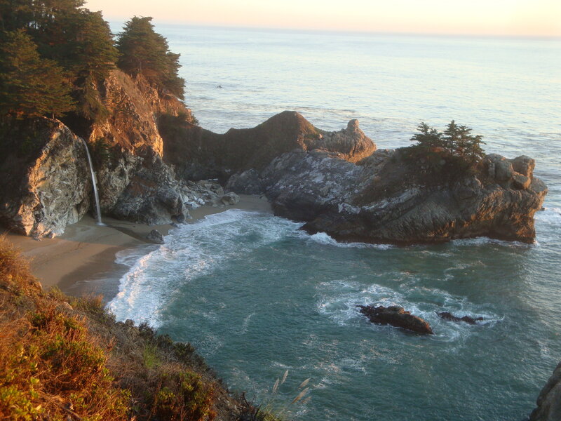 coastal waterfall at sunset