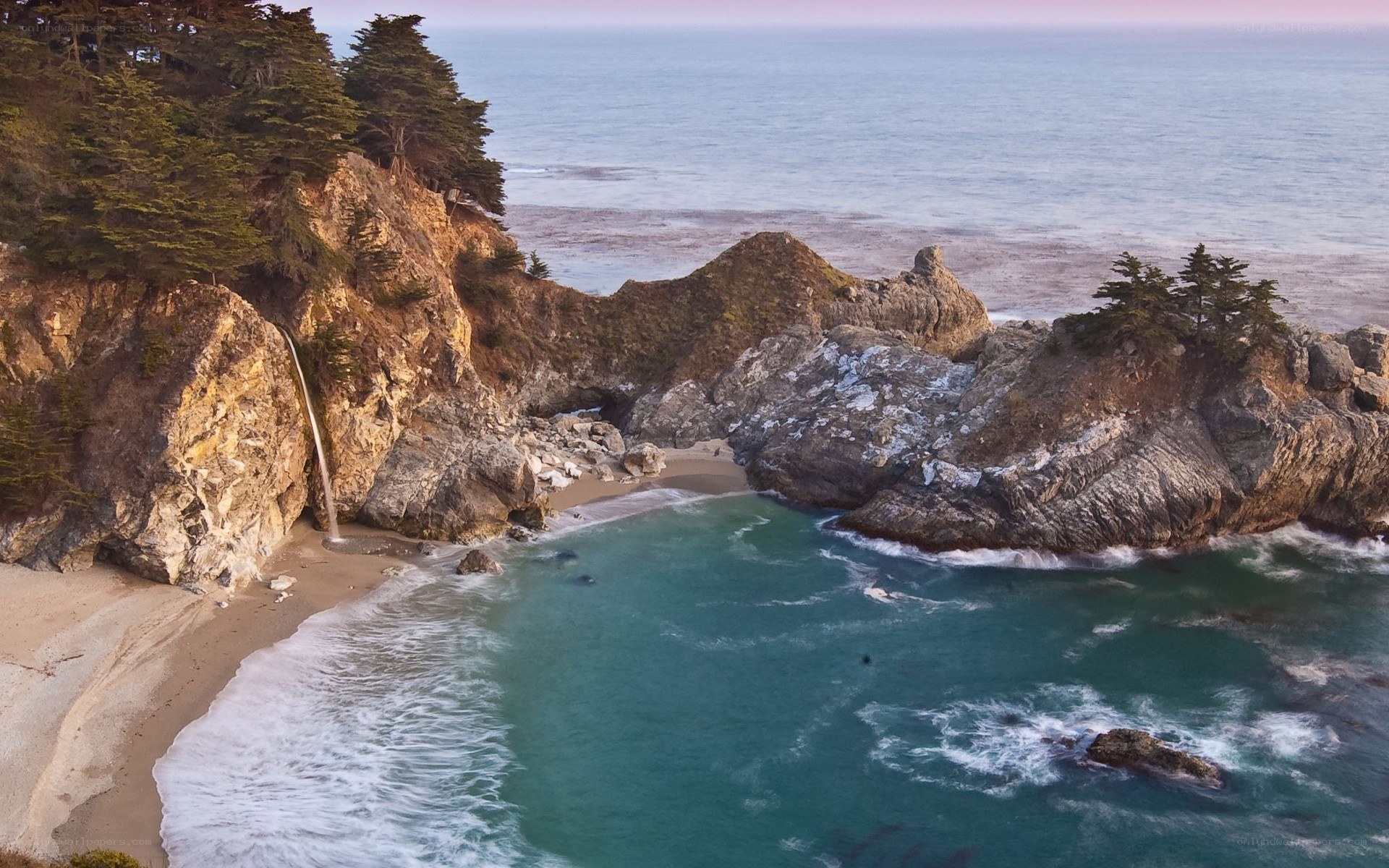 coastal waterfall at sunset