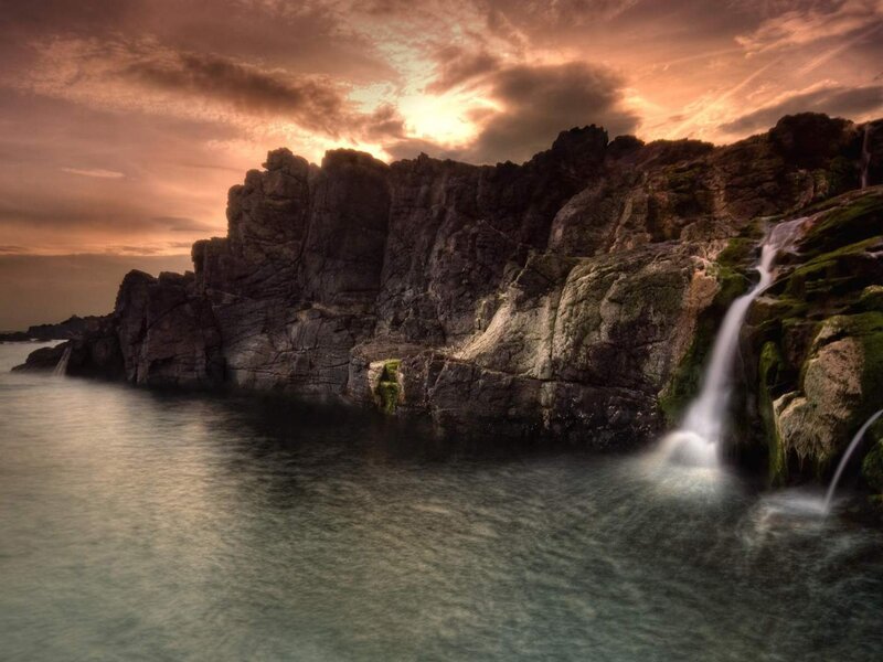 Coastal Waterfall at Sunset — Orange, Dramatic, Photograph