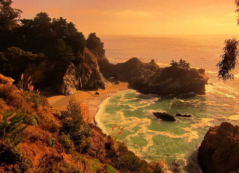 Coastal Waterfall at Sunset — Orange