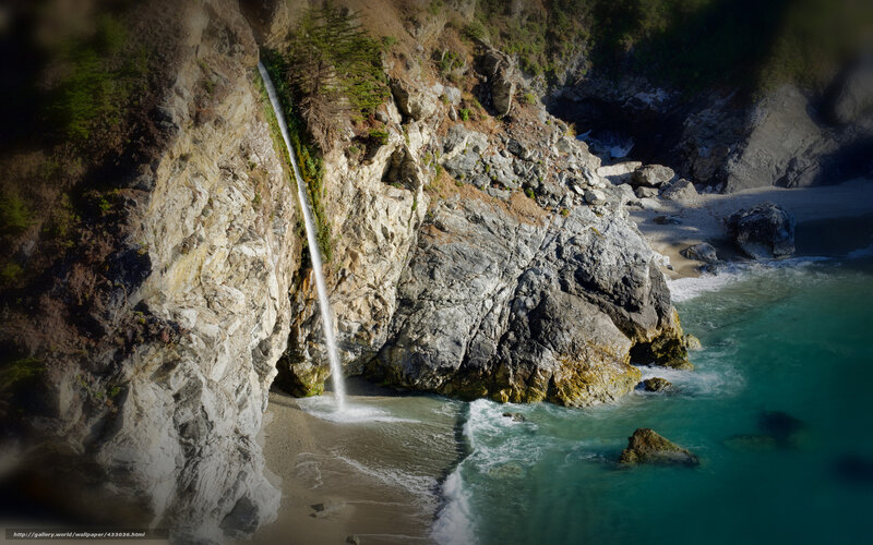 coastal waterfall cascading into ocean
