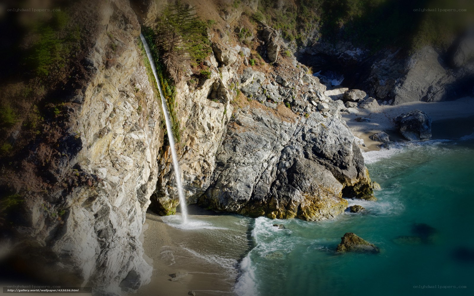 coastal waterfall cascading into ocean