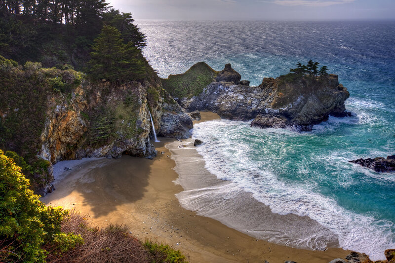 Coastal Waterfall into Ocean — Blue, Serene, Afternoon