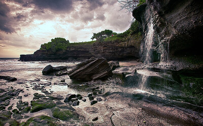 Coastal Waterfall on Rocks