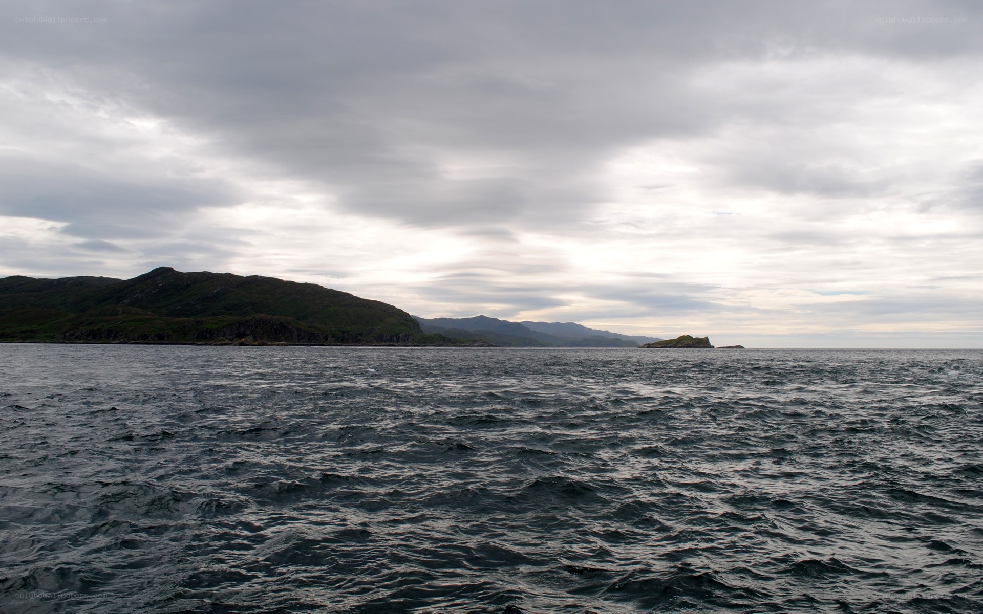 coastal waters under cloudy sky