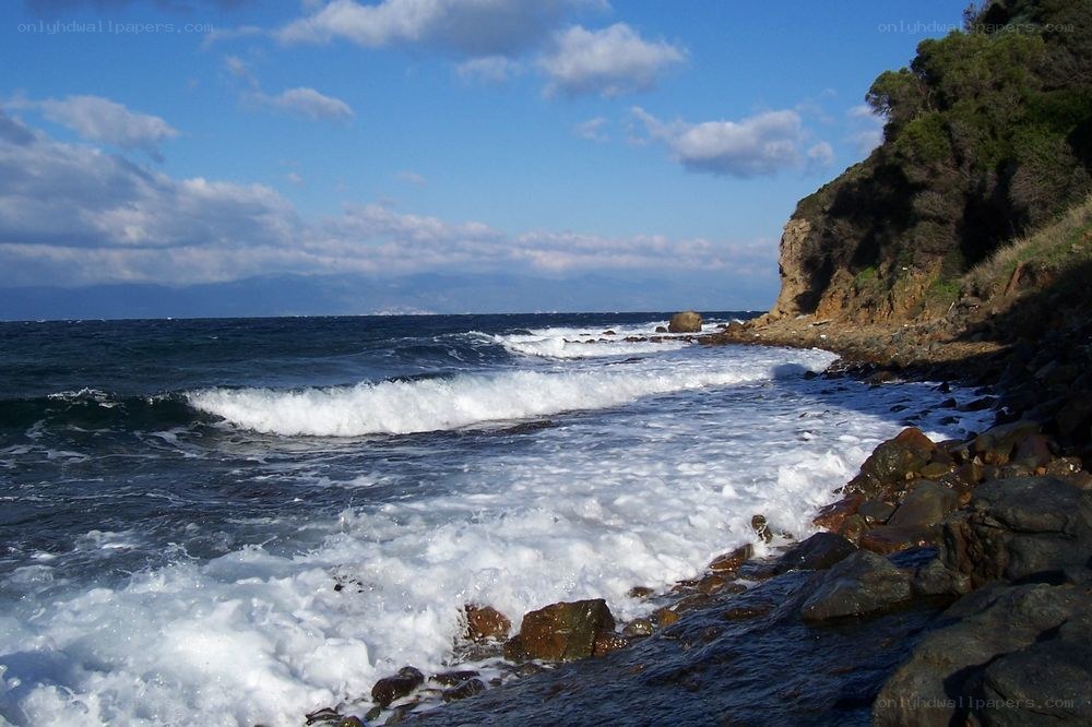 coastal waves crashing on rocks