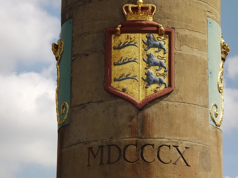 coat of arms on stone pillar